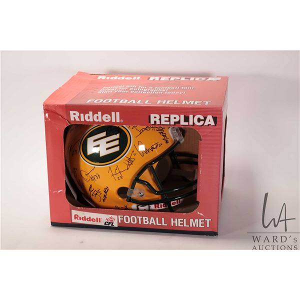 Riddell Replica Edmonton Eskimos Football helmet with team signatures