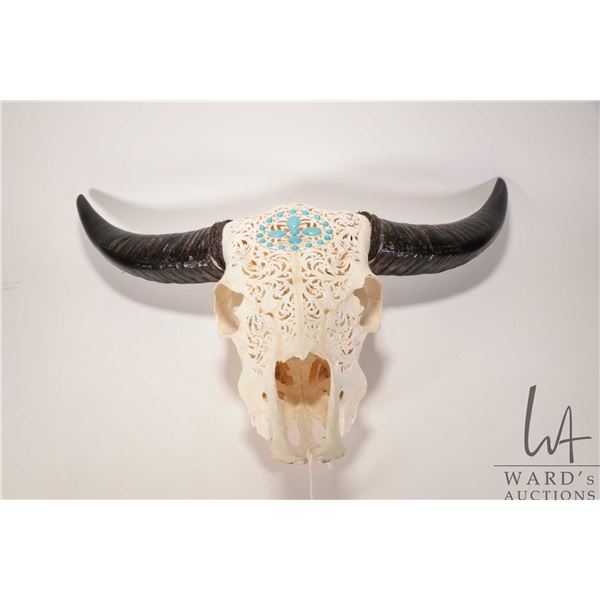 Hand carved cow skull with attached horns and turquoise decoration, 26" wide X 17"