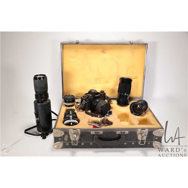 Cannon A1 35mm camera with lens plus a wide angle lens, 50mm lens, Sigma zoom lens and fitted hard c