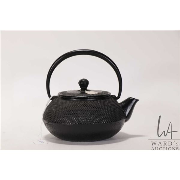 Black cast iron teapot