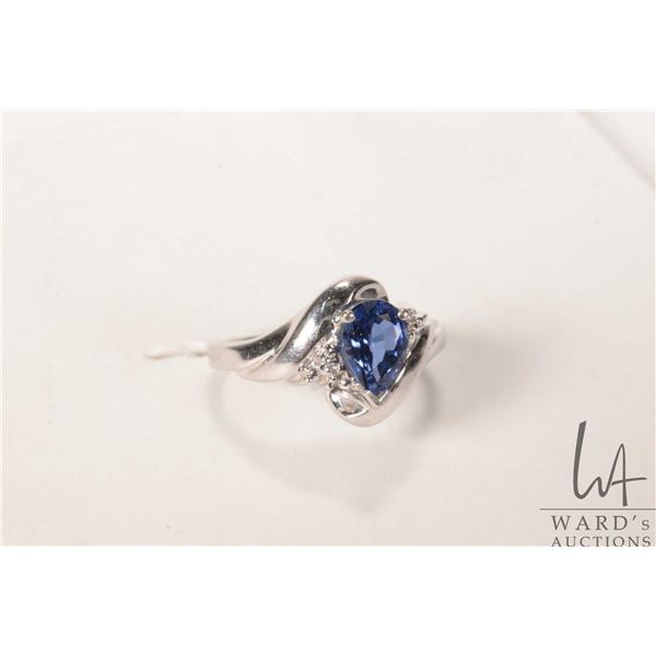 10kt white gold ring set with blue pear shaped gemstone, size 6.5
