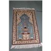 Image 1 : Small silk blend fringed area carpet with blue background, bird and fountain motif and highlights of