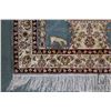 Image 4 : Small silk blend fringed area carpet with blue background, bird and fountain motif and highlights of