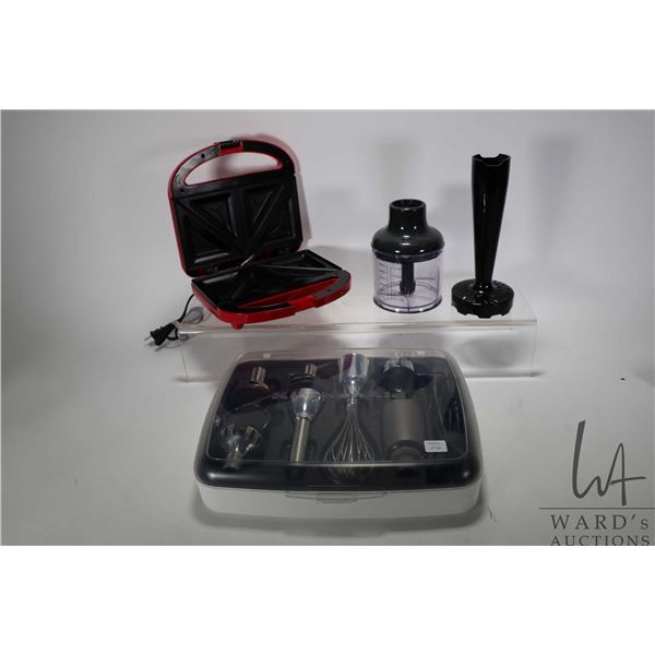 Kitchenaid variable speed corder hand blender with accessories and a Cuisinart sandwich grill