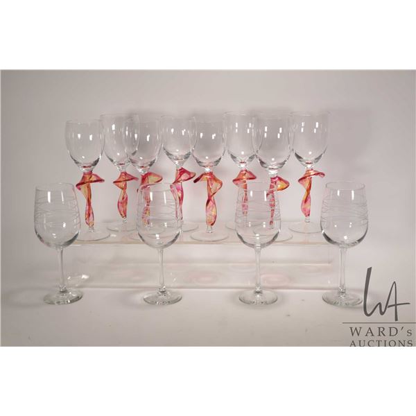 Eight artisan wine glasses with colourful glass stems and four crystal goblets with etched bowls