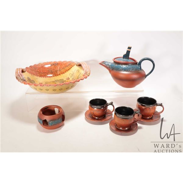 Artisan made and hand signed teapot with grain elevator finial and three clay teacups and saucers pl
