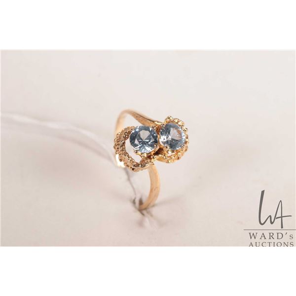 10kt yellow gold ring set with two round citrine/ citrine like blue gemstones, size 8.25