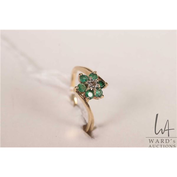 10kt yellow gold ring set with emerald/ emerald like gemstones, size 5.75