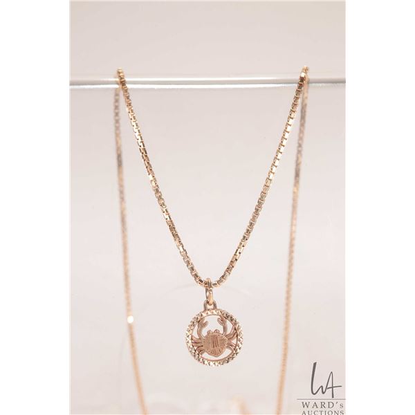 10kt yellow gold 18" box chain with 10kt yellow gold cancer birth sign pendant