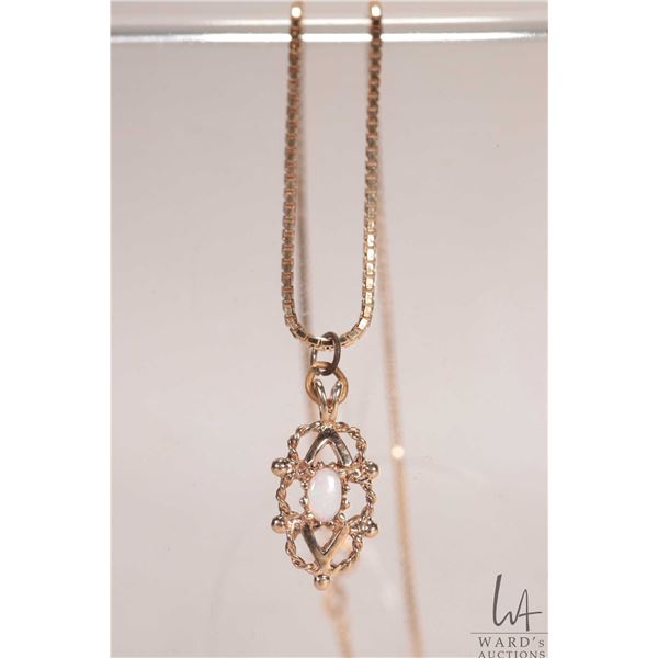 10kt yellow gold 18" box chain with 10kt yellow gold pendant set with opal gemstone