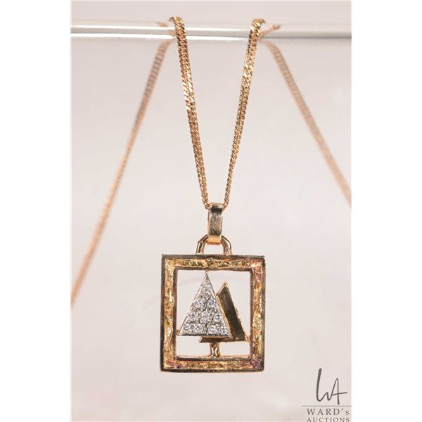 10kt yellow gold 20" neck chain with 10kt yellow gold tree pendant set with ten small diamonds