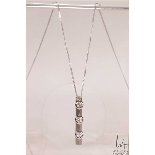 18kt white gold neck chain with tested 18kt white gold and three diamond pendant, 18" in length