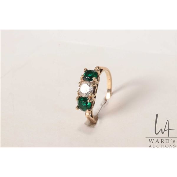 10kt yellow three stone ring set with three round gemstone like stones, size 6.5