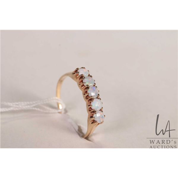 10kt yellow gold ring set with five opal gemstones, size 8.25