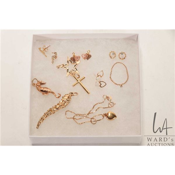 Selection of 10kt and 14kt gold jewellery including four pairs of earrings, four pendants and a 10kt