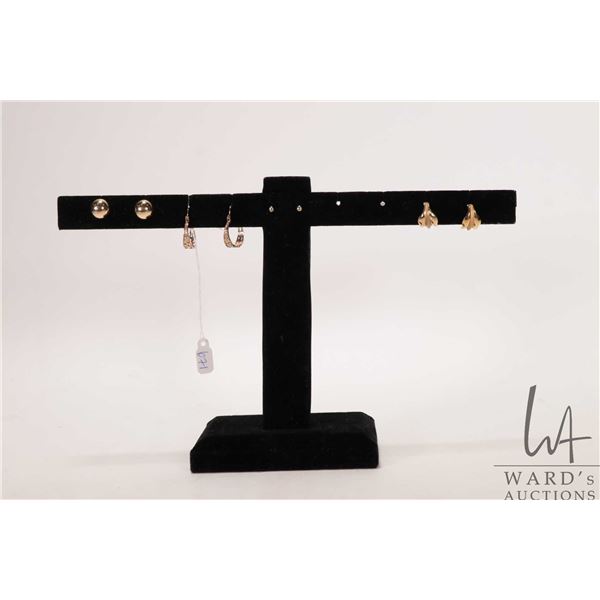Three pairs of 10kt yellow gold earrings plus a pair of small diamond earrings