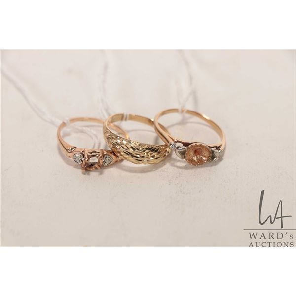 Three 10kt yellow gold rings, note: two missing gemstones