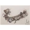 Image 1 : Vintage silver charm bracelet with approximately 30 sterling/ silver charms