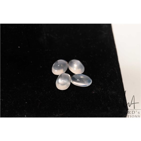 Four cabochon moonstone/ moonstone like gemstones