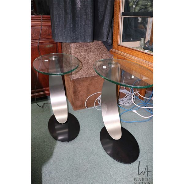 Pair of modern glass topped side tables with curved aluminum pedestals 21" H X 12" X 19"