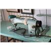 Image 2 : Consew Model 105 commercial sewing machine on industrial stand with foot pedals, working at time of 