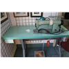 Image 4 : Consew Model 105 commercial sewing machine on industrial stand with foot pedals, working at time of 