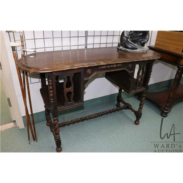 Small antique writing desk with book storage on either side and barley twist supports, 30" H X 48" X
