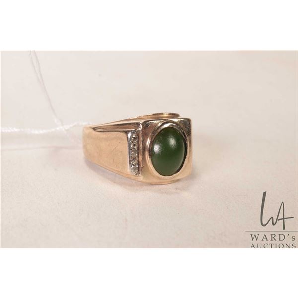 Gent's 10kt yellow gold ring set with green cabochon center stone and three small accent diamonds, s