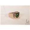 Image 1 : Gent's 10kt yellow gold ring set with green cabochon center stone and three small accent diamonds, s