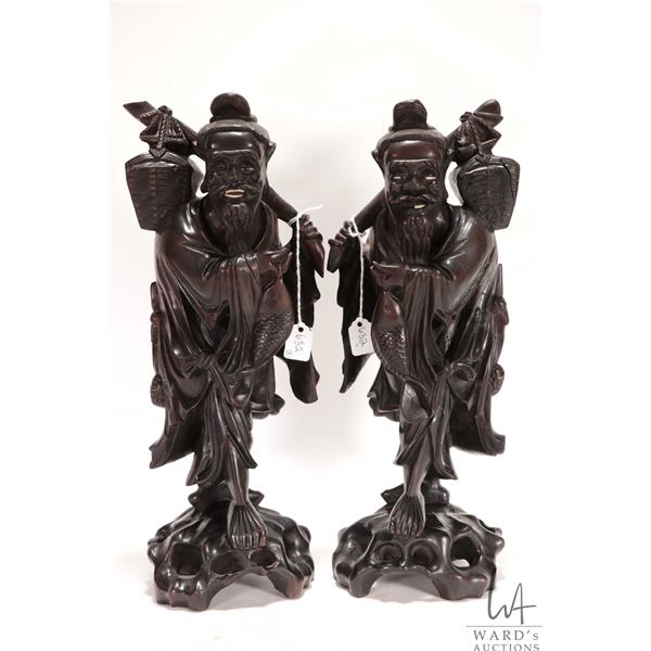 Two quality Chinese rosewood carvings of Immortals, each 14" in height