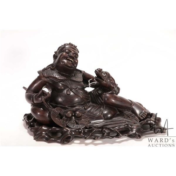 Quality rosewood carving of the Chinese Immortal Liu Hai with inset teeth and eyes, on fitted carved