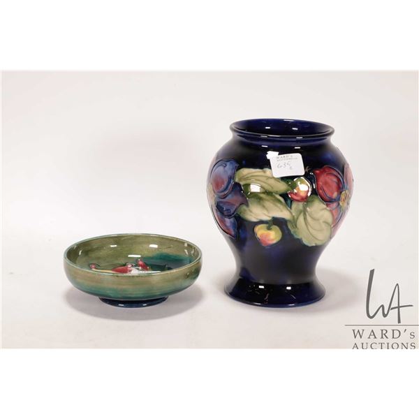 Two pieces of Moorcroft pottery including 6" anemone bowl, and African lily round dish, both pieces 