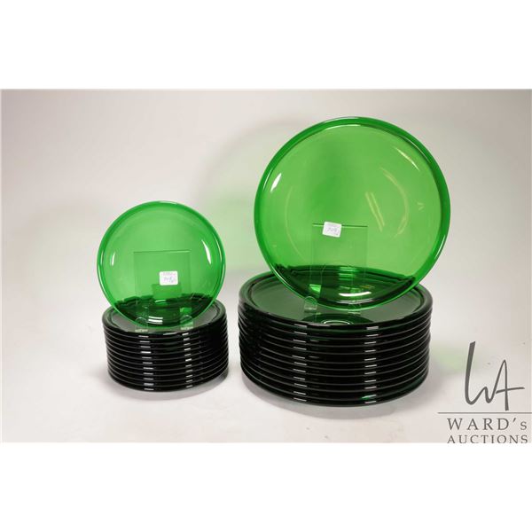 Twelve each 11" green glass dinner plates and 7" plates