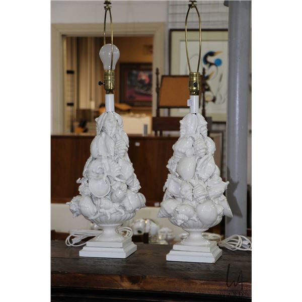Pair of blanc de chine shell motif table lamps, 30" to the top of the harp