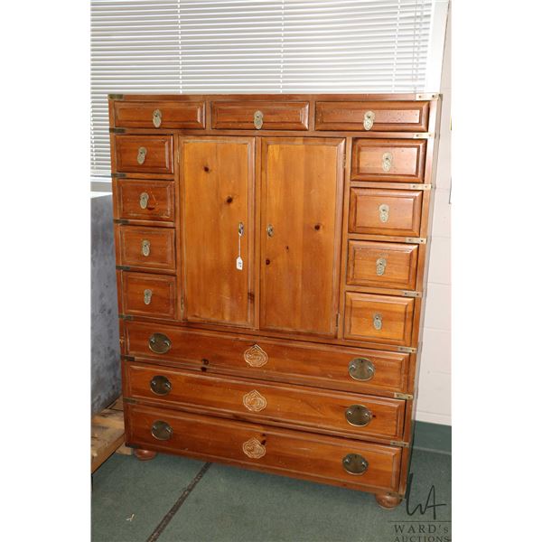 Vintage Henredon Japanese Tansu style armoire or tall chest made of solid knotty pine with fourteen 