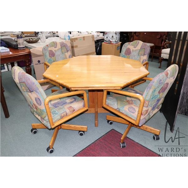 Laminated oak octagonal dining table with single pedestal 48" and plus four swivel chairs on castors