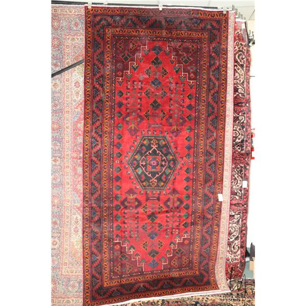 100% hand made Iranian wool carpet, Baluchi, with center medallion, red background and highlights of