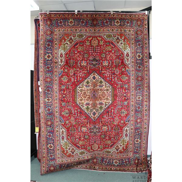 100% hand made Iranian wool carpet, Tabriz with center medallion, red background and highlights of g