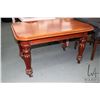 Image 1 : Antique mahogany occasional table with heavy bulbous legs and brass castors, 29" H X 46" X 31"