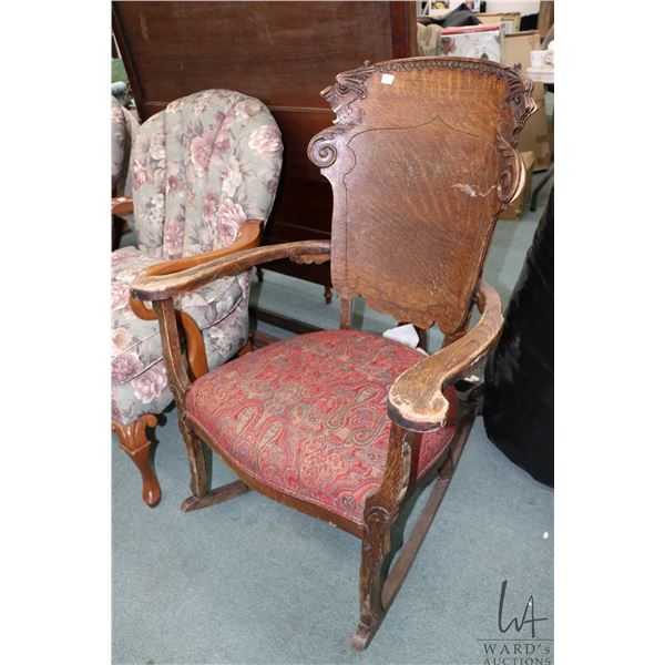 Antique quarter cut oak, open arm rocking chair with figural decorative show wood