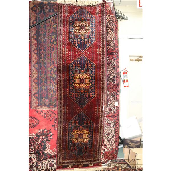 Wool carpet runner with triple medallion red background and highlights of blue, cream etc. 32" x 114