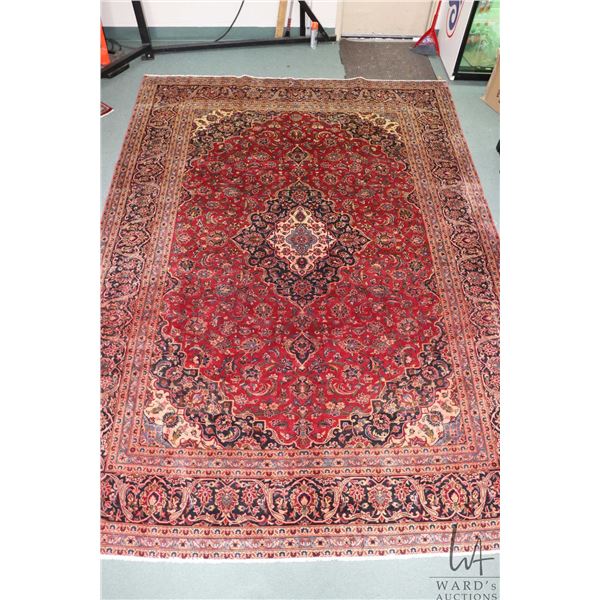 100% hand made Iranian wool carpet, Kashan, center medallion, red background and highlights of black