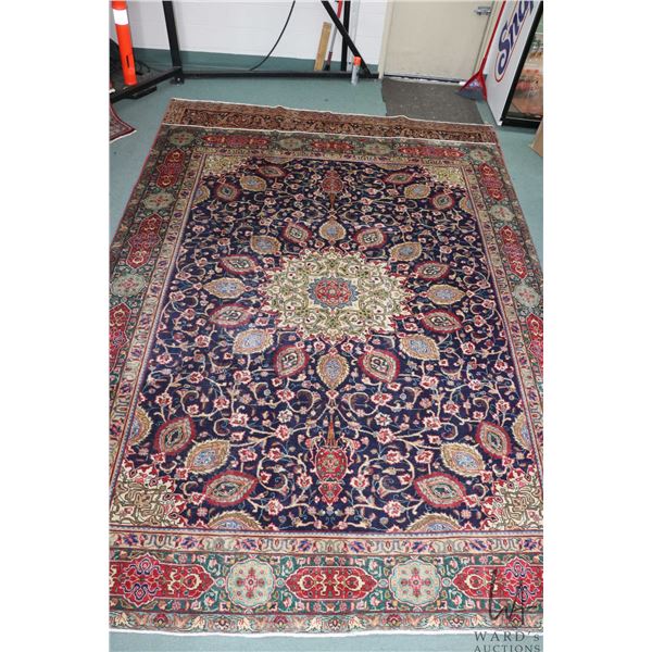 100% hand made Iranian wool carpet, Tabriz with center medallion, blue background and highlights of 