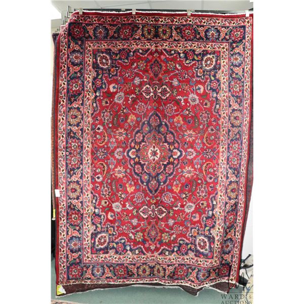 100% hand made Iranian wool carpet, Mashad, center medallion, red background and highlights of blue,