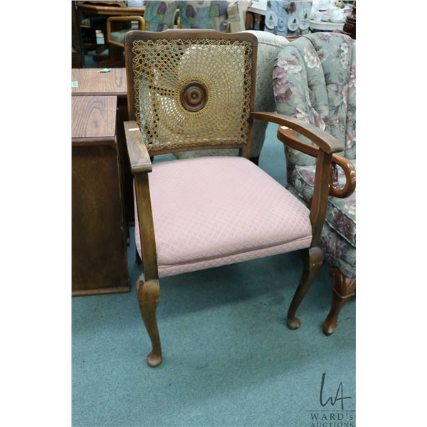 Mid 20th century open arm parlour chair with woven rattan and turned cameo back