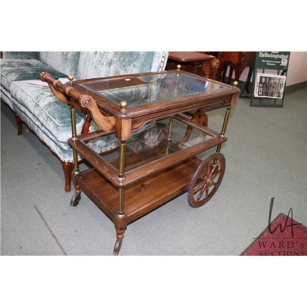Semi contemporary tea trolley with glass shelves and fold down handle, 28" X 19" X 31"