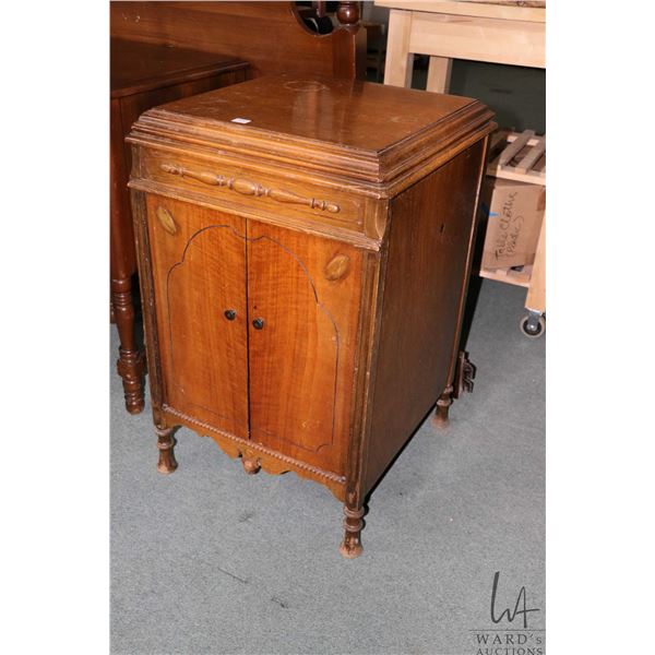 Gramophone cabinet that has been lowered and fitted for sewing notions