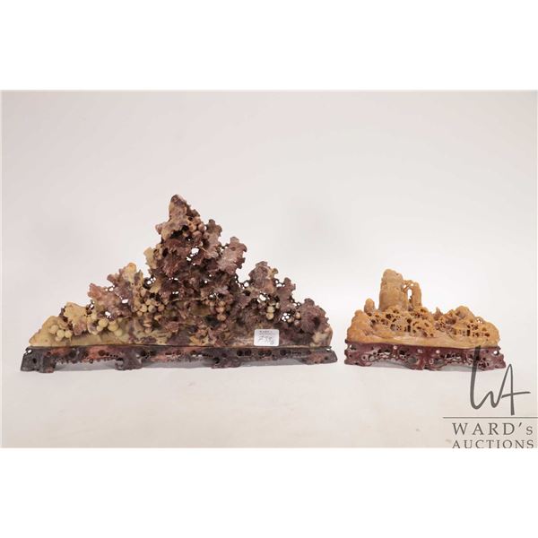Two Japanese hand carved soapstones including 6" long village and a grape leaf carving 13" in length