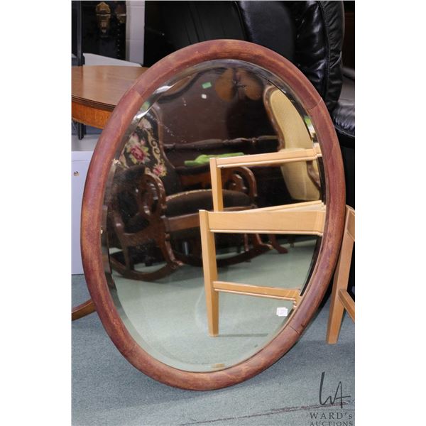 Antique wood framed oval beveled wall mirror Outside dimensions 33"x27"