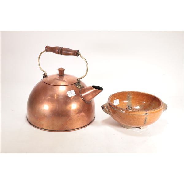 Large lidded copper kettle and a glazed pottery strainer